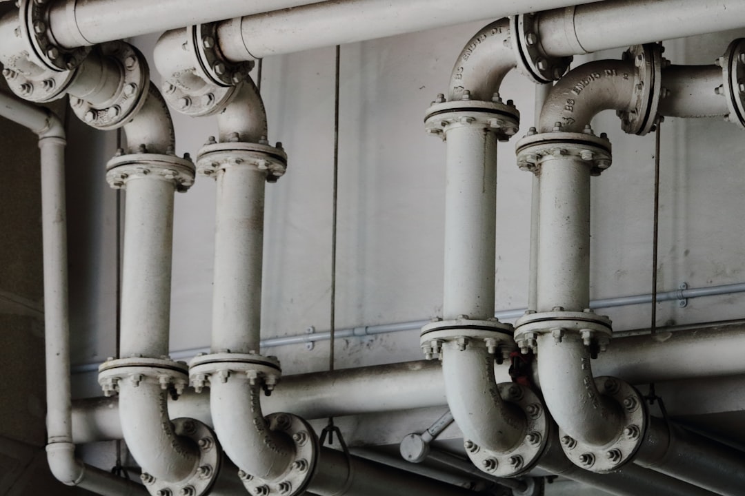 grayscale-photography-of-metal-pipes-scubcassvbe
